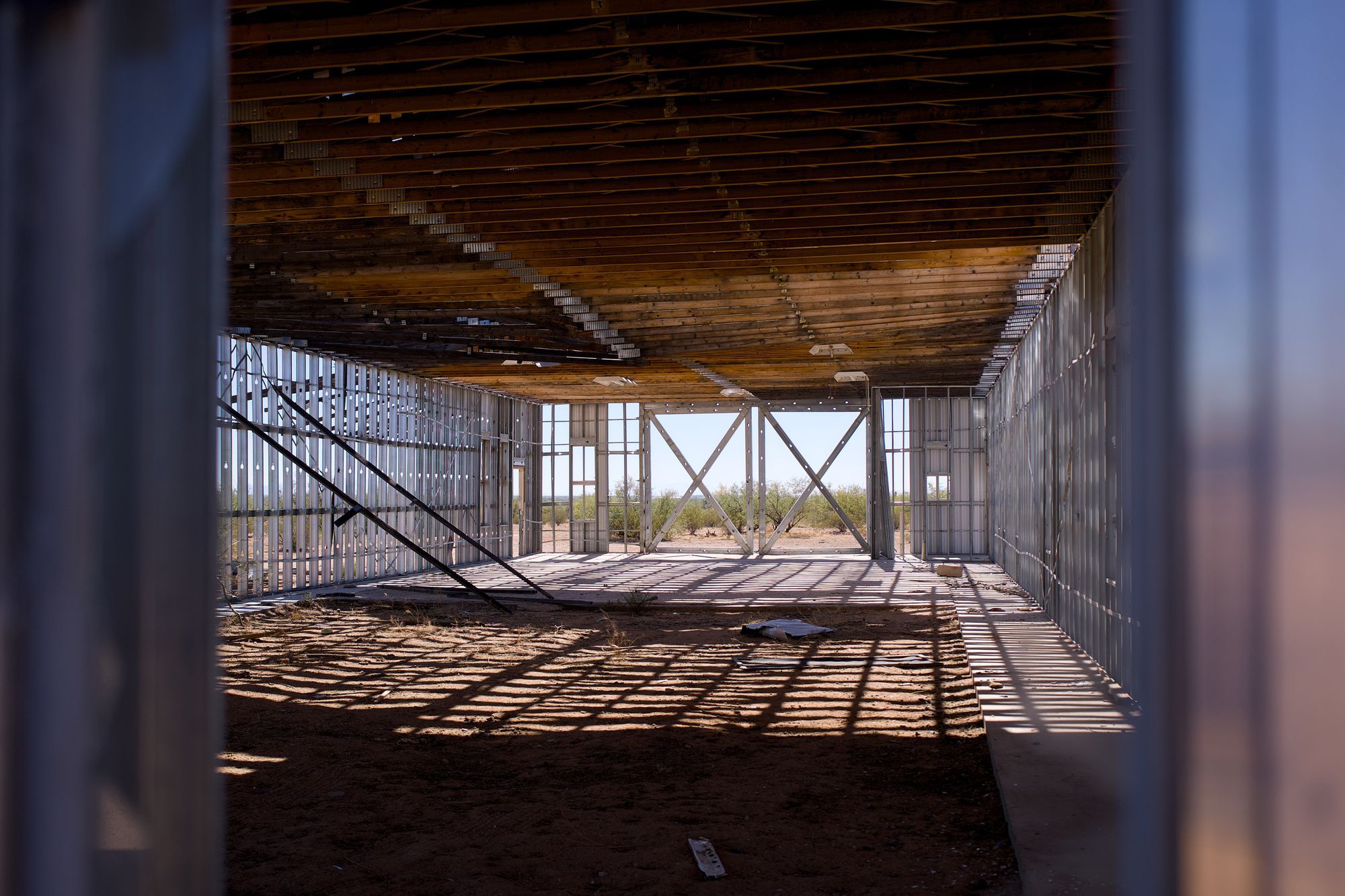 Commercial space framed with metal studs under a wood deck ceiling
