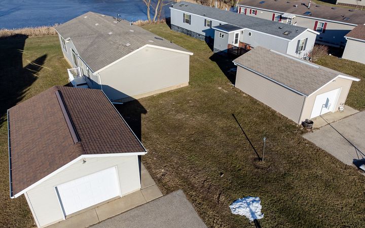 Manufactured homes with detached garages, seen from above