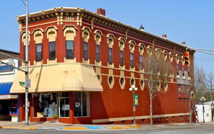 Red brick corner building from the 1800s in downtown Plymouth, Indiana