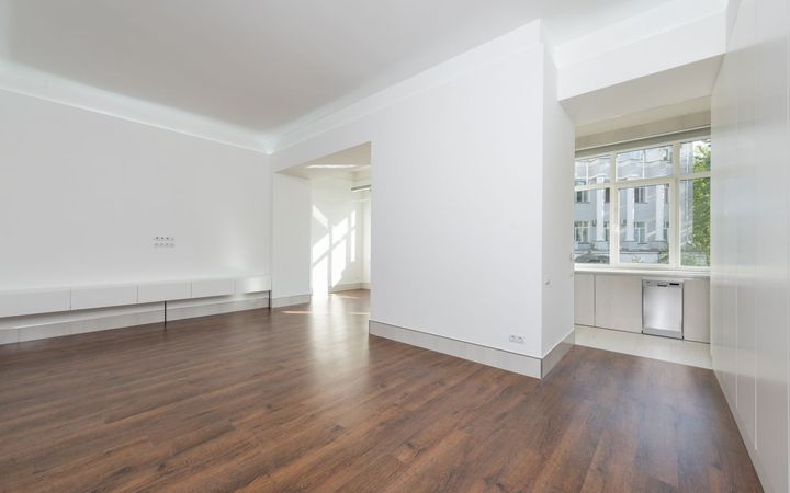 Empty room with white walls and a bare floor