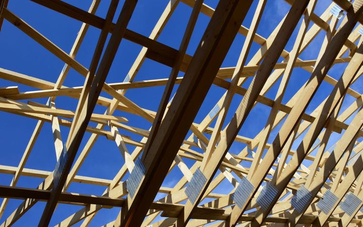 Roof trusses seen from below before the ceiling goes up